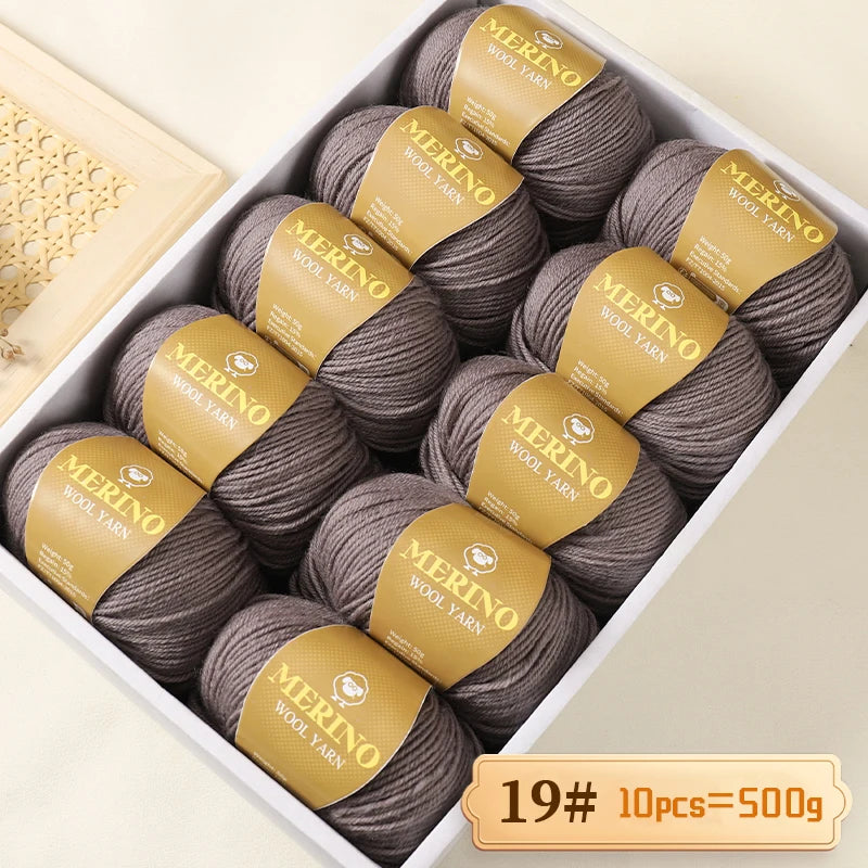 A box filled with 10 balls of Merino wool yarn, labeled as 19# wool yarn, totaling 500g.