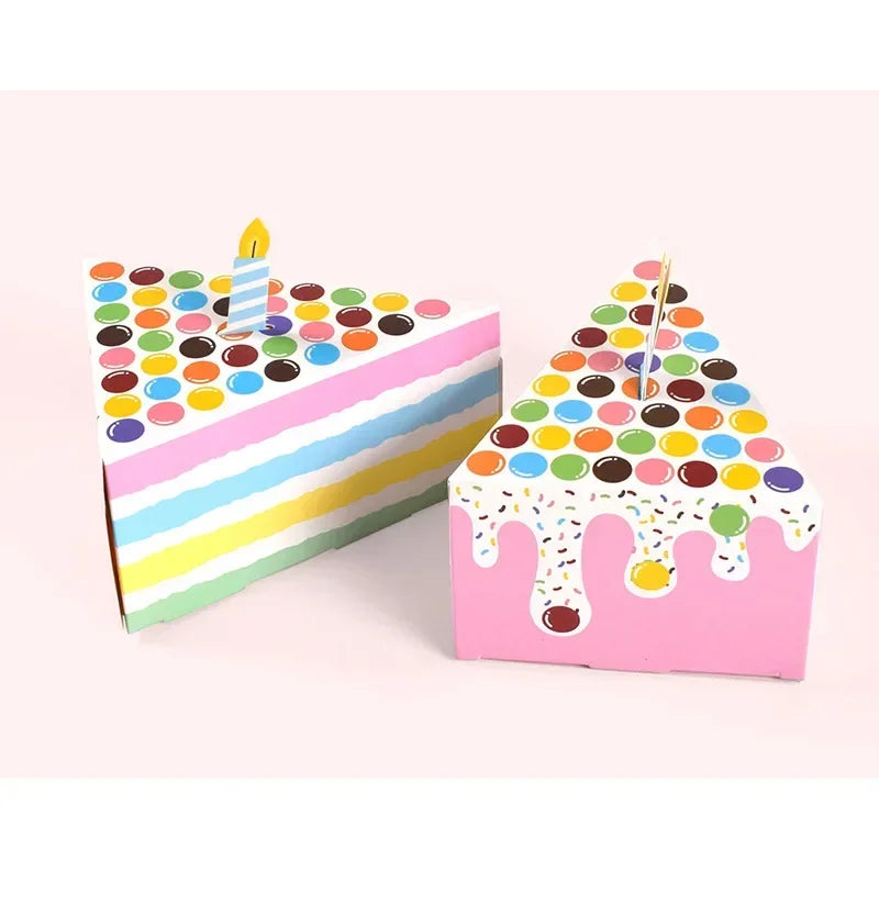 Colorful paper gift boxes decorated with dot shapes and dripping icing, suitable for party favors.