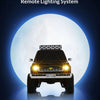 A 1/24 scale Chevrolet K5 Blazer RC crawler with remote lighting system mounted on the front.