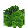 Green faux monstera palm leaves used for indoor and outdoor decoration