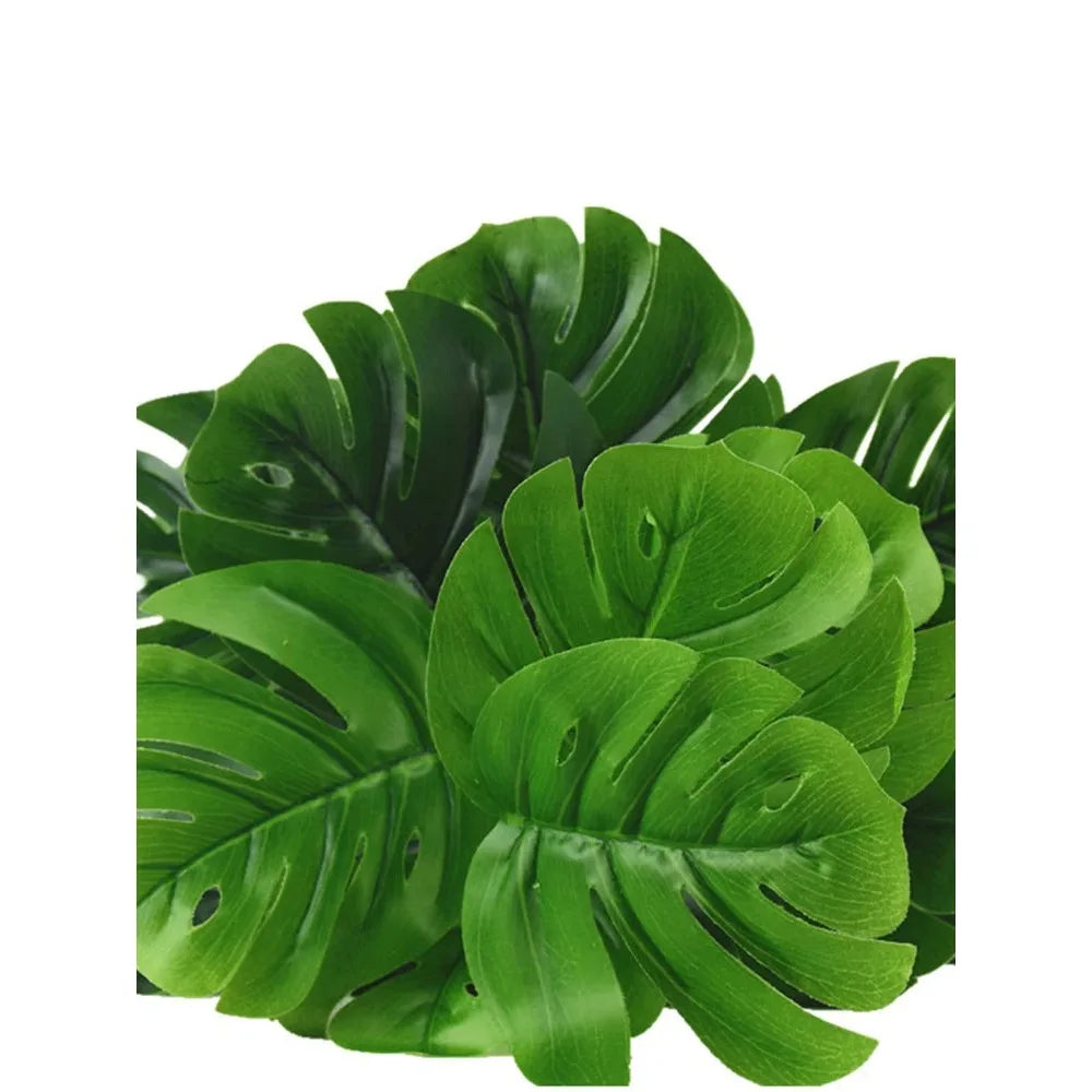Green faux monstera palm leaves used for indoor and outdoor decoration