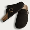 Black suede cork mules with a brown strap and arch support