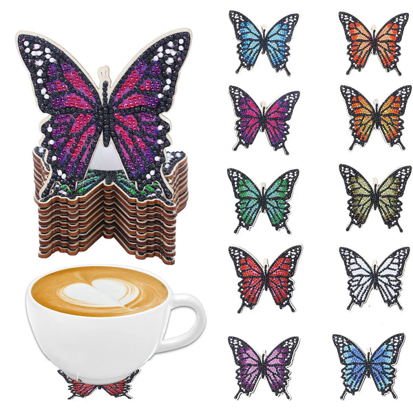 Ti sommerfugldiamantkunst- coastere med ulike farger og glitterdesign.