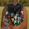 A collection of natural stone cross pendants displayed on a wooden background.