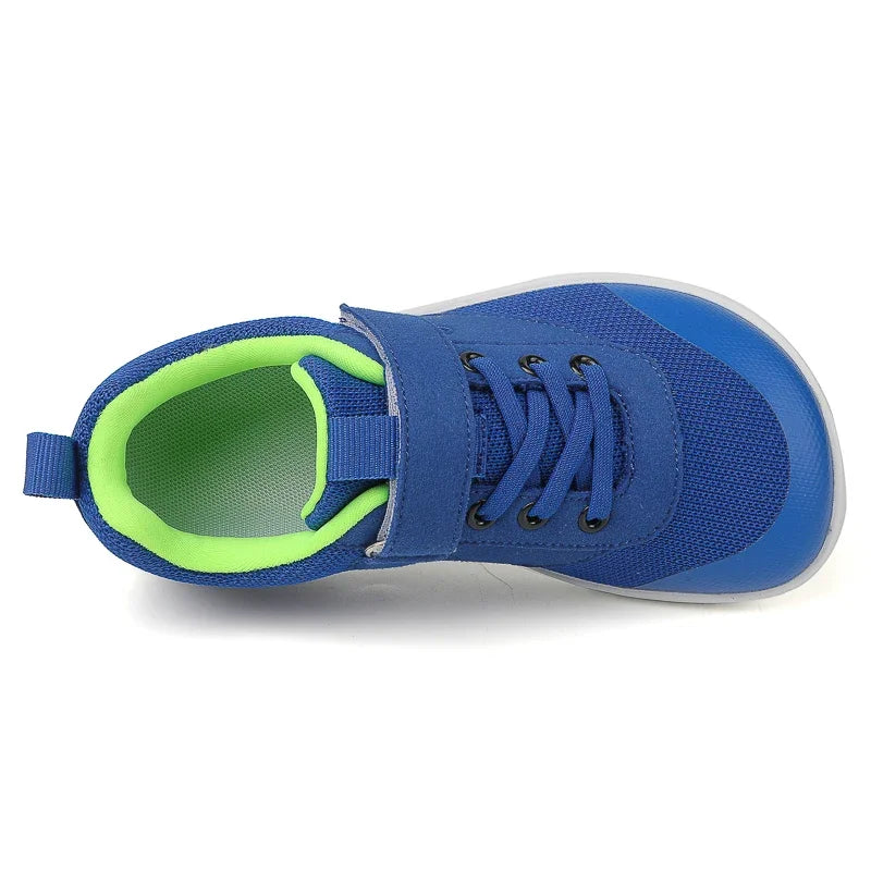 A blue and light blue kids barefoot training sneaker with a neon green lining.