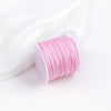 A pink roll of 0.8mm cotton nylon macrame cord for jewelry making and crafts.