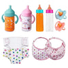 A set of seven baby feeding and care accessories including bottles, nipples, and a diaper cover.