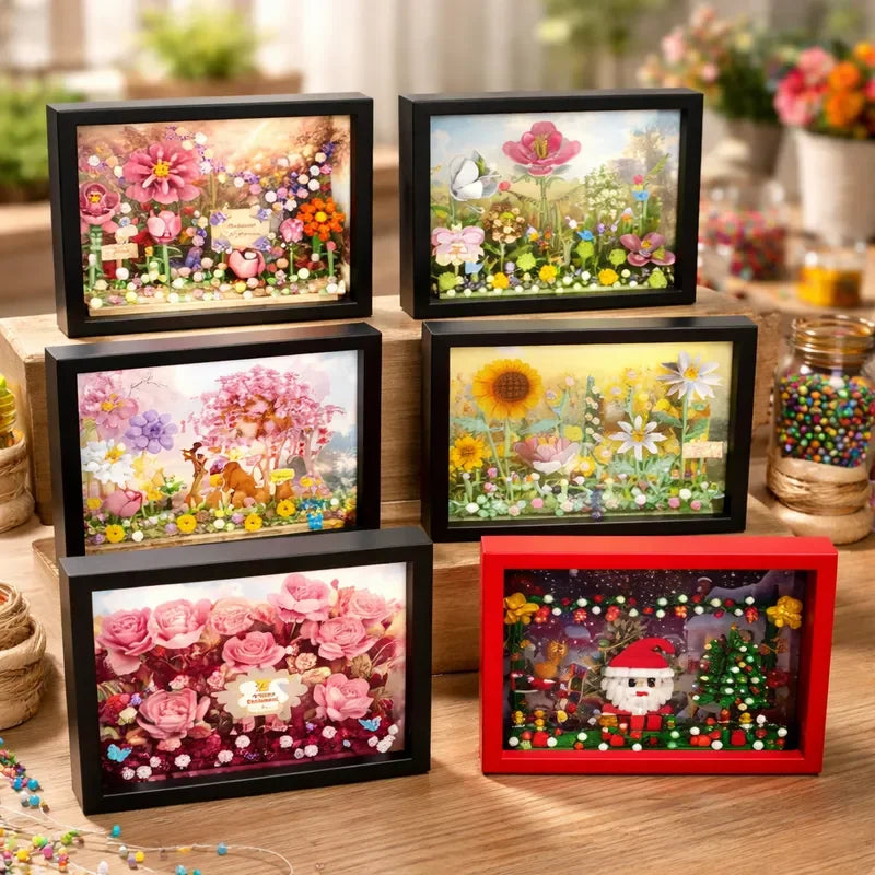 A set of four framed displays featuring colorful 3D flower building blocks and nature scenes.