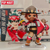 A collectible PVC figurine of a male character wearing a hat and red armor, displayed on a clear stand.