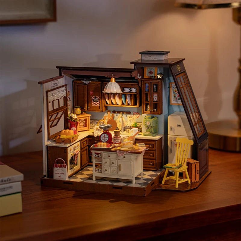 A miniature dollhouse kit featuring a cozy baking kitchen with wooden cabinets and tools.