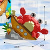 A set of ocean animal building blocks featuring a shark, crab, and clownfish in red and yellow colors.