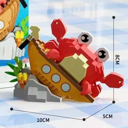 A set of ocean animal building blocks featuring a shark, crab, and clownfish in red and yellow colors.