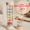 A wooden rain sound shaker toy with colorful beads and a white cloud, demonstrating the sound of rain.