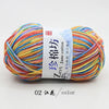A ball of multi-colored yarn, featuring shades of orange, yellow, blue, and pink, labeled as Zun Jane cotton yarn.