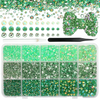 A collection of flatback resin rhinestones in various shades of green and gold, including loose stones and a storage tray.