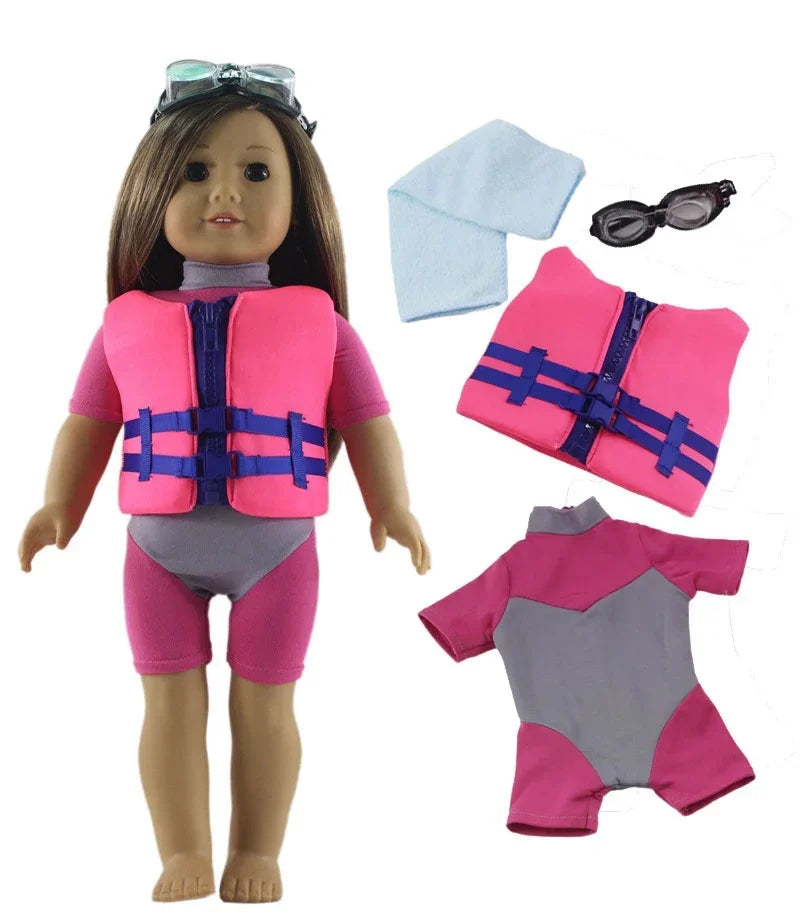 A doll wearing a pink top and purple vest with blue accents, accompanied by sunglasses and a pink outfit set.