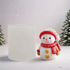 A cute snowman figurine wearing a red hat and scarf is displayed next to a white candle.