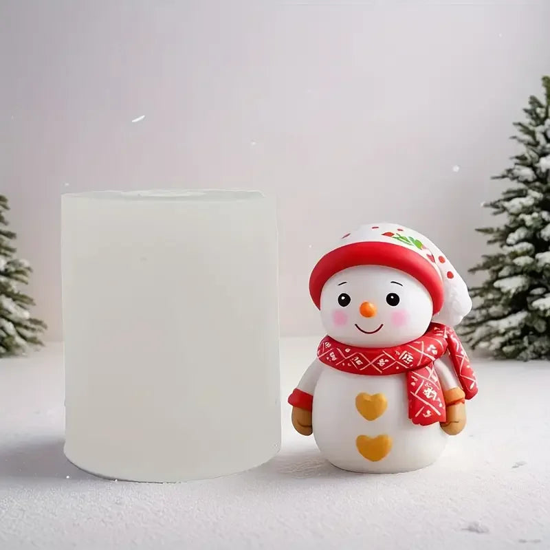A cute snowman figurine wearing a red hat and scarf is displayed next to a white candle.