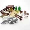 A set of marine animal building blocks including a shark, octopus, whale, and other sea creatures on a beige base.