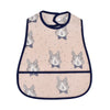 A light pink baby bib featuring a repeating cartoon rabbit pattern with gray and white accents.