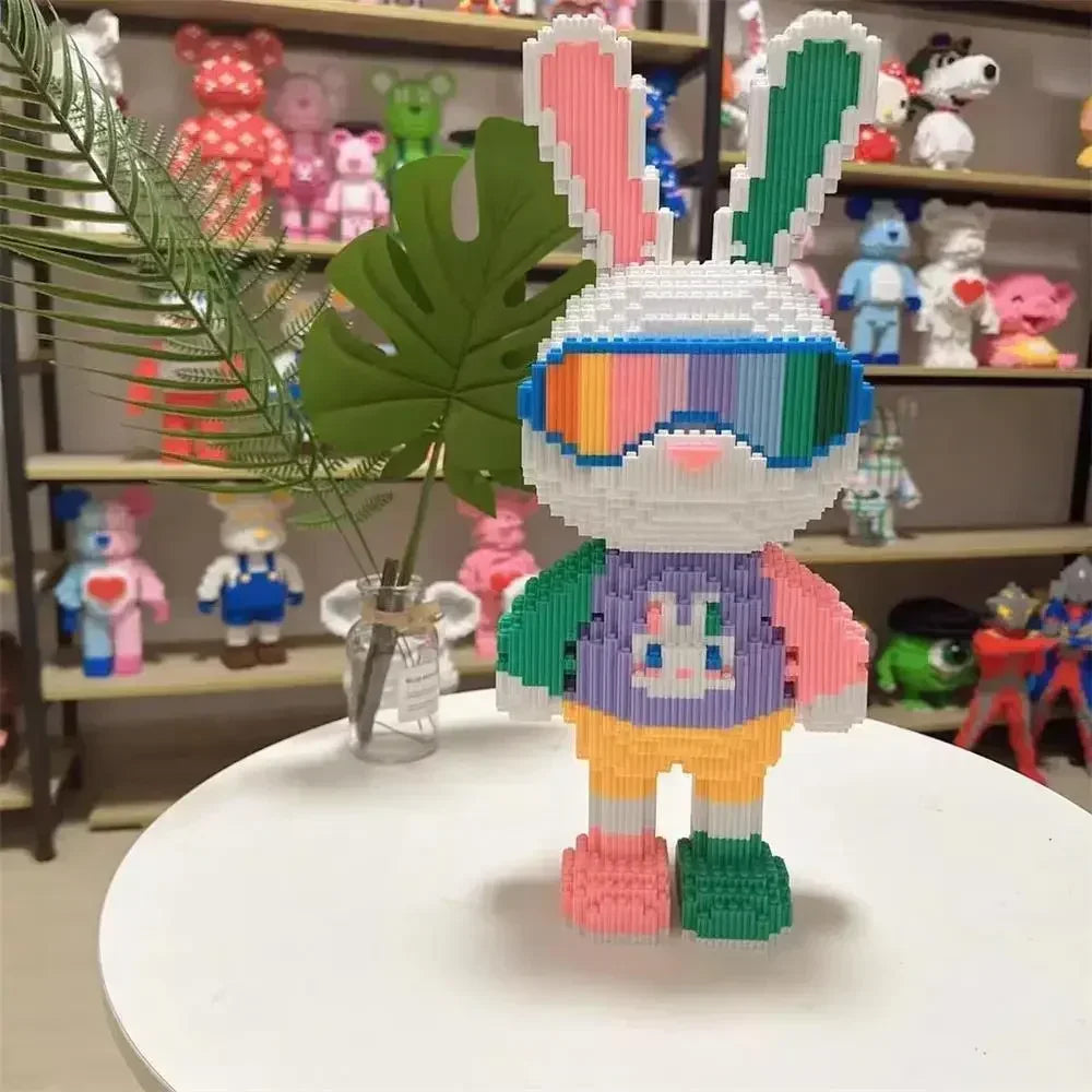 A fully assembled rabbit building block toy made of micro bricks with pink, blue, and green accents.