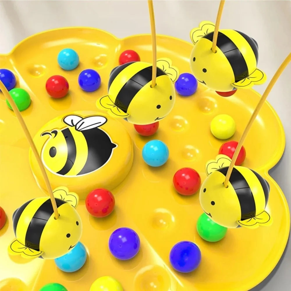 A yellow board game featuring a bee theme with colorful balls and fishing rods for kids
