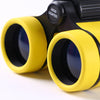 A pair of yellow binoculars with black accents, ready for birdwatching.