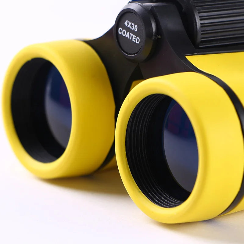 A pair of yellow binoculars with black accents, ready for birdwatching.