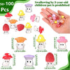 A collection of glow-in-the-dark resin miniature mushrooms in various colors and sizes for fairy garden décor.