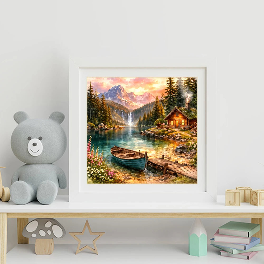 A framed painting of a mountain landscape featuring waterfalls, evergreen trees, and a wooden cabin.