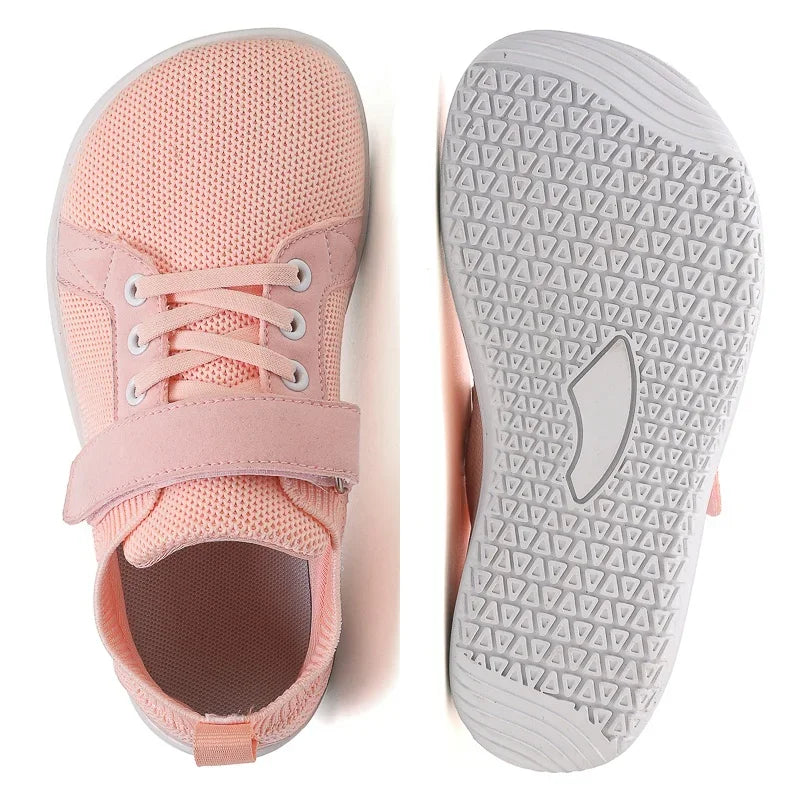 Pink minimalist barefoot sneakers shown from the top and sole views.