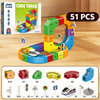 A set of magnetic building blocks train track featuring various colored blocks, vehicles, and track components.