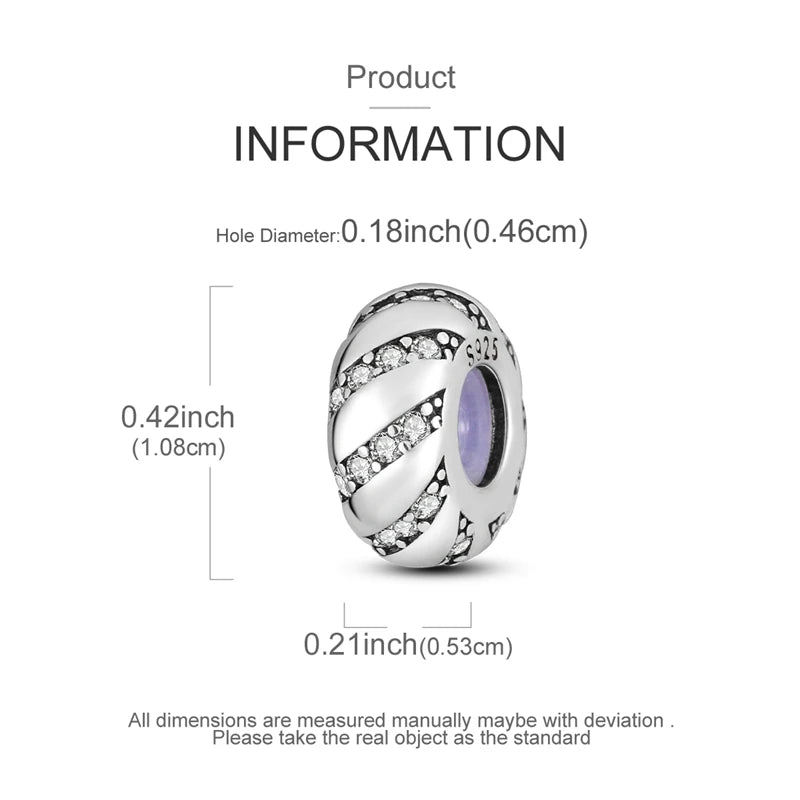 A sterling silver charm bead with an engraved design and a purple gemstone set against a white background.