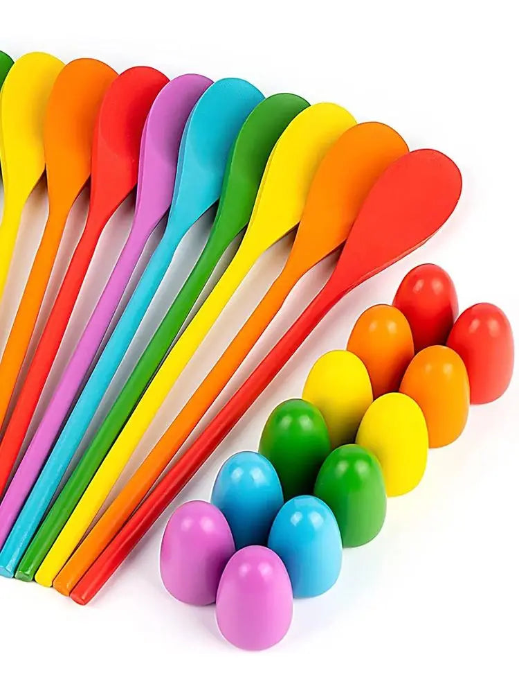 A set of colorful plastic spoons and egg-shaped scoops for a kids game
