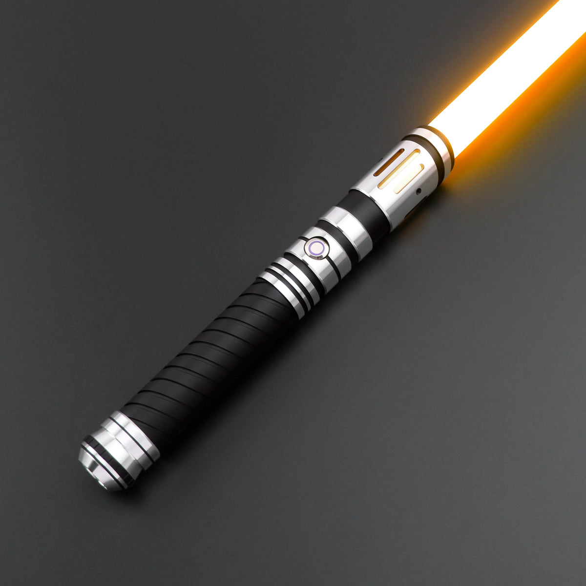 A premium metal lightsaber with an illuminated blade and black grip is shown diagonally against a dark background.
