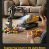 A child operates a yellow RC excavator with an articulated arm, playing with building blocks in a living room.