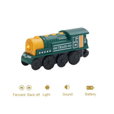 A green wooden train set with a yellow engine and racing track components.