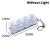A set of four clear acrylic key buttons with a metal keyring, shown without light.