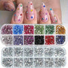 A display of multi-size flat back acrylic rhinestones in various colors and shades for nail art and DIY crafts.
