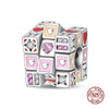 A set of colorful, heart-shaped and diamond-shaped 925 sterling silver rubik's cube charms for bracelets.