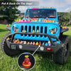 A blue Jeep is decorated with numerous rubber ducks on its roof and hood.