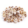 A pile of 50 imitation jade acrylic cloud beads in various natural and milky white shades for jewelry making.