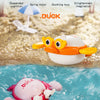 A set of wind-up swimming bath toys featuring ducks and other animals floating in blue water.