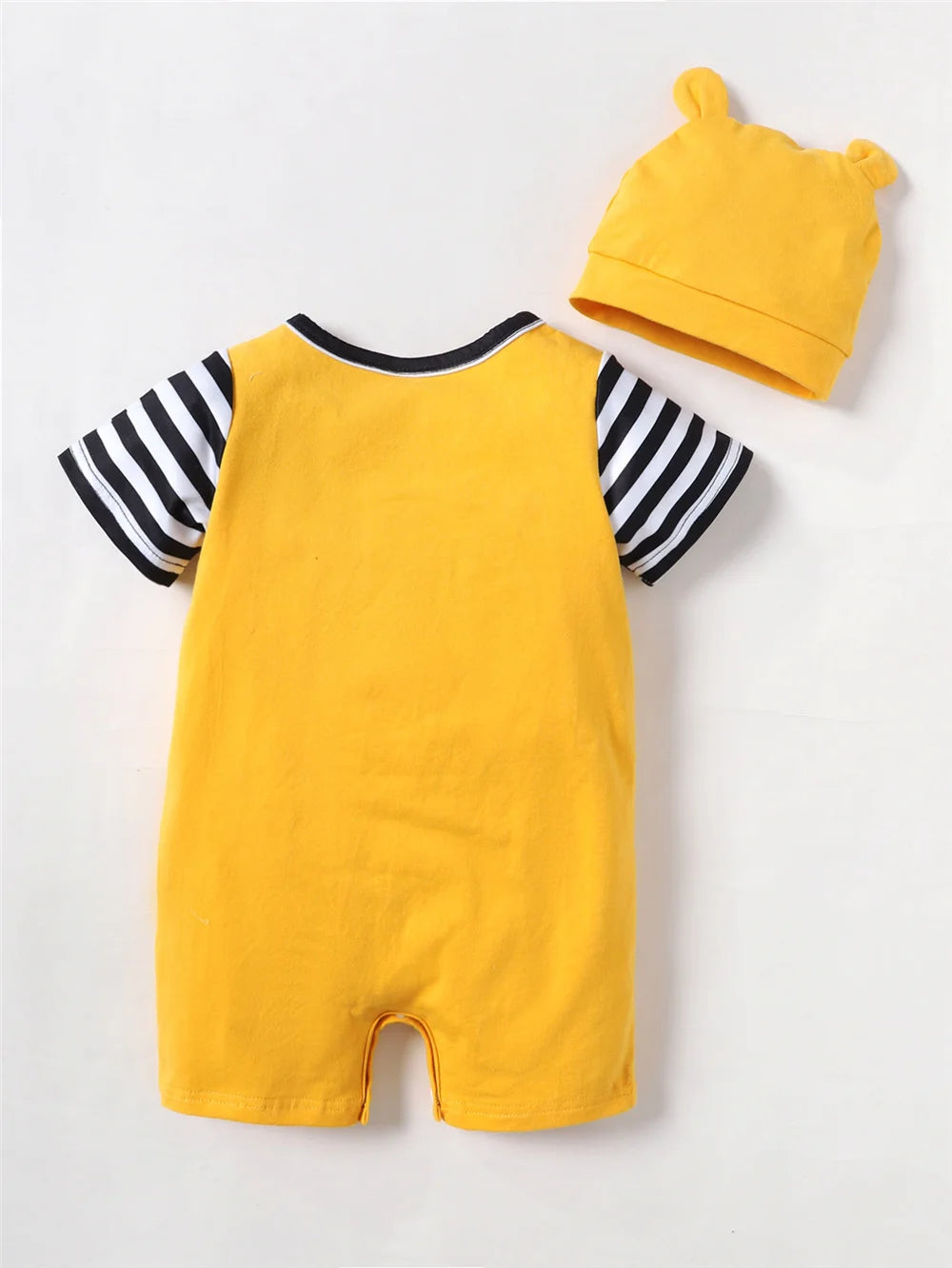A yellow short sleeve romper and matching hat for a baby, featuring black and white stripes on the sleeves.