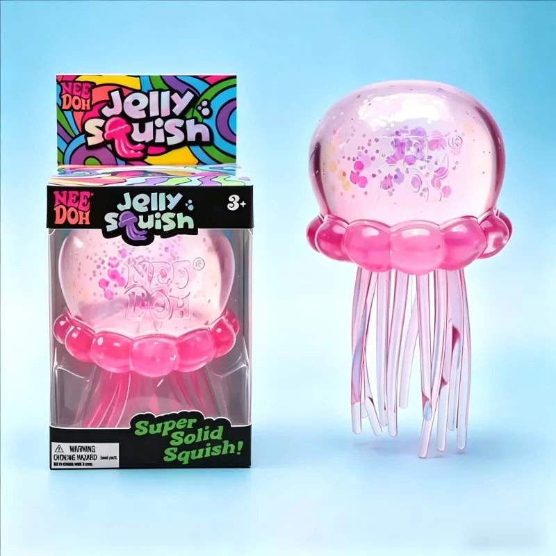 A box and toy of the Nee Doh Jelly Squish toy in pink with purple speckles, showing its squishy texture and dangling tentacle