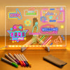 An LED acrylic message board displaying the word OPEN and GAME with seven colored pens in front of it.