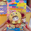 A plush doll blind box featuring a cute character with yellow fur and pink accents.