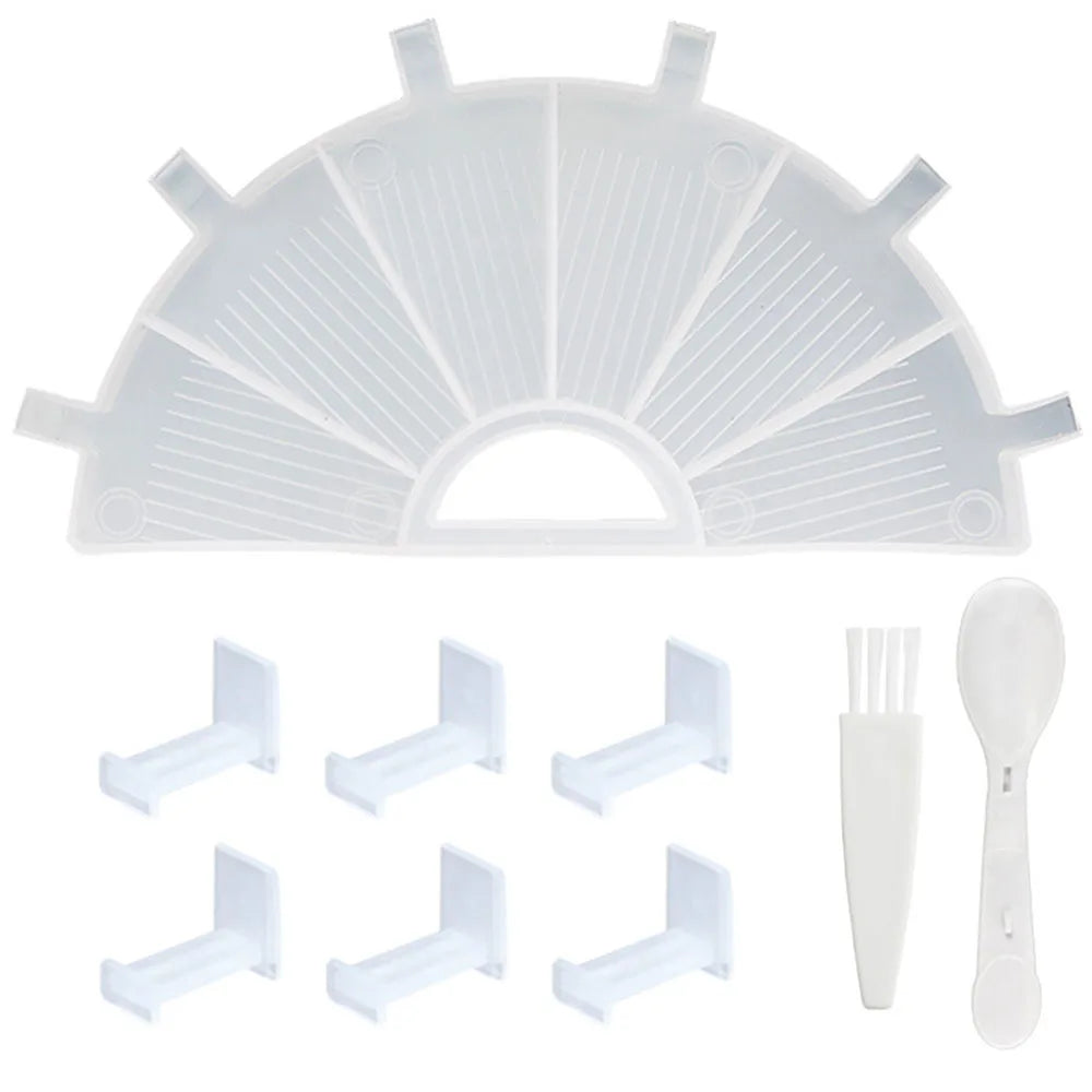 A clear plastic organizer tray for diamond painting with six compartments and a included pen.