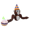 An orange and gray gorilla plush toy with a conical hat and a number four attached to its hand.