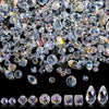 A collection of 300 crystal glass beads in various mixed shapes and sizes with an AB finish.